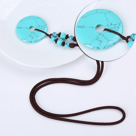 Yumten-Anhänger mit rundem Stein in Türkis